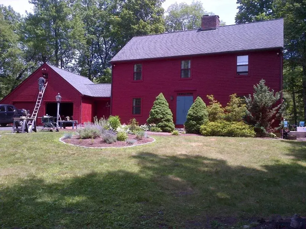 Front view of a newly painted home with an attached two-car garage.