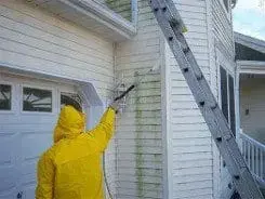 Power washing a home exterior